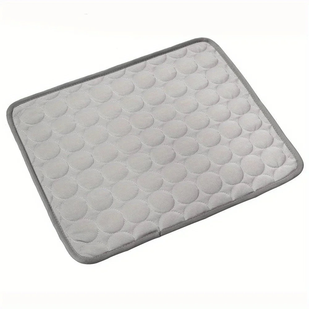 CoolMat pet cooling mat in gray, quilted circle pattern, laid flat