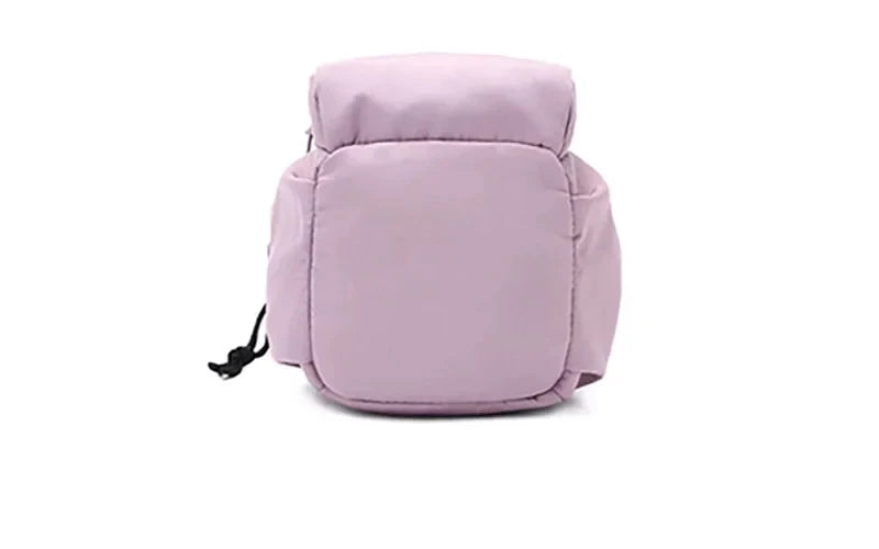 Back view of light purple CarrySling bag showing rounded shape and side pocket without bottle