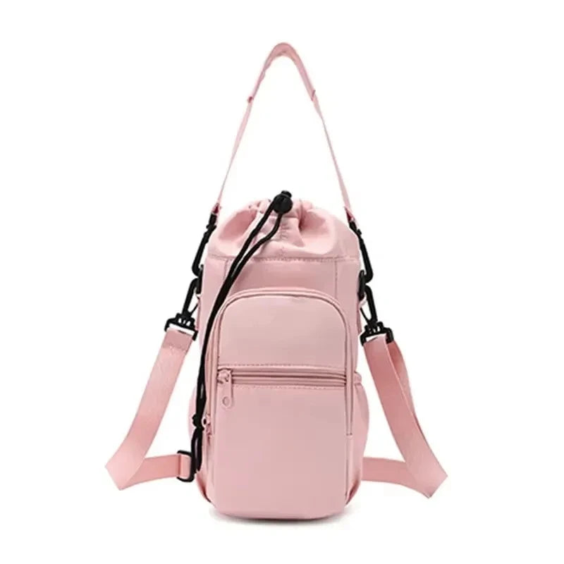 Pink CarrySling bottle carrier bag with adjustable strap, front zipper pocket, and drawstring top