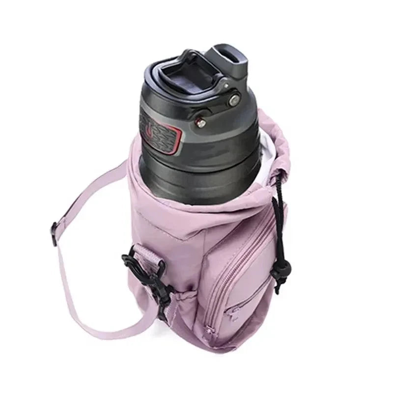 Light purple CarrySling bag open with a large dark gray insulated bottle inside, showing snug fit