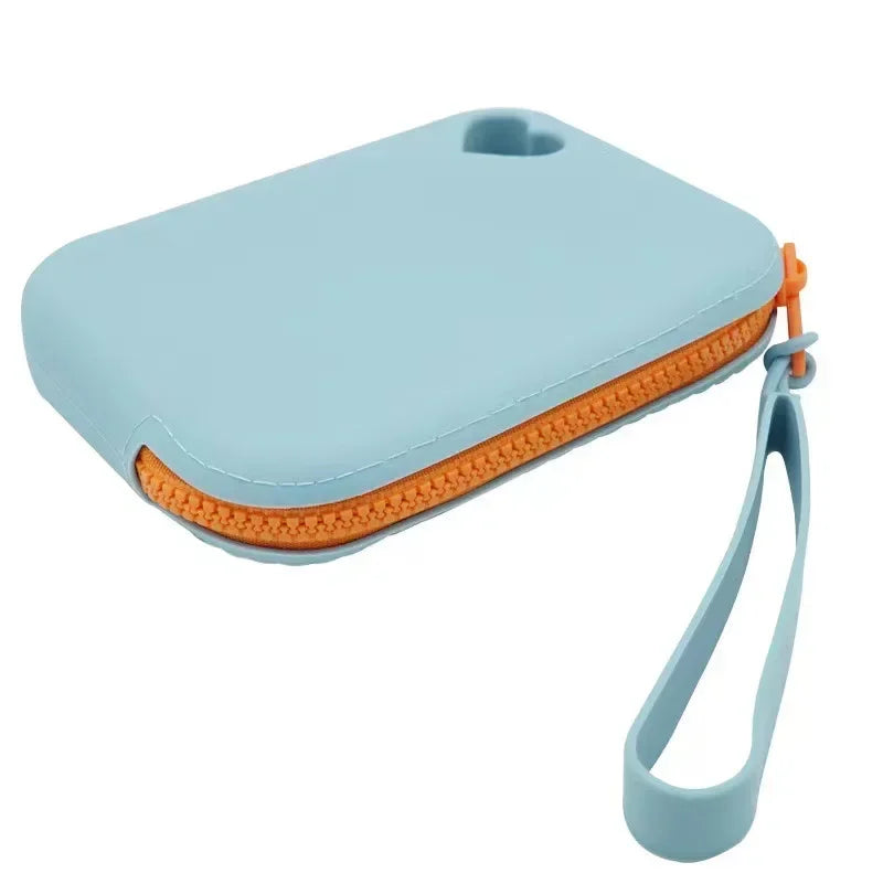 TrailTreat pouch in light blue with orange zipper, angled product shot