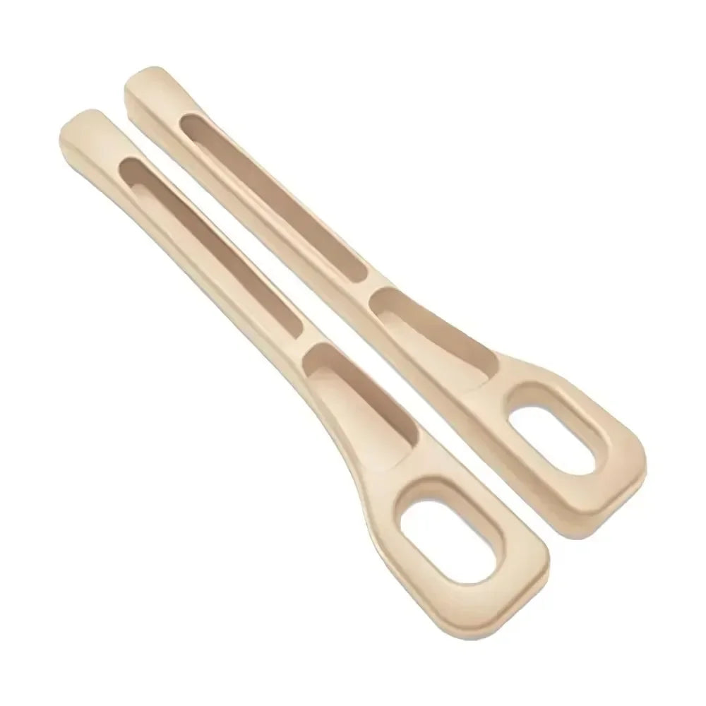 Pair of beige GapGuard seat gap fillers on white background, showing curved shape and slotted design