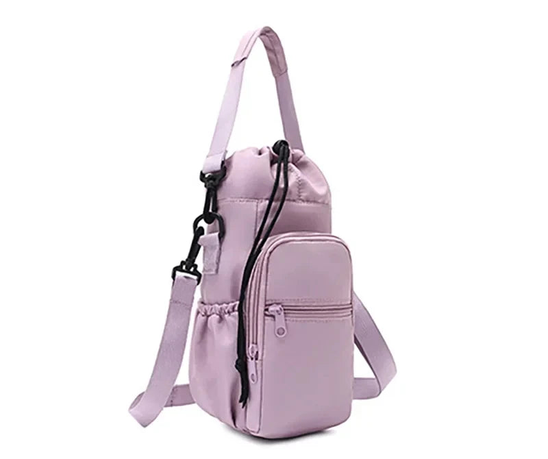 Three-quarter angled view of light purple CarrySling bag showing front pocket and shoulder strap